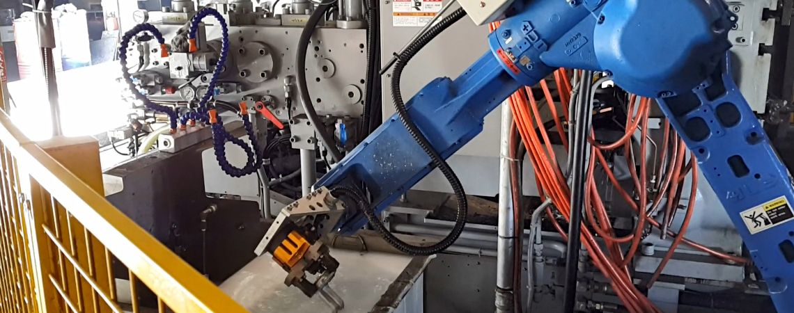 Yaskawa GP25 robotic arm places the casting into the cooling water tank to reduce temperature.