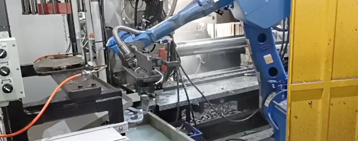 Yaskawa GP50 robotic arm places the casting into the cooling water tank to reduce temperature, with the trimming machine installed above the tank.